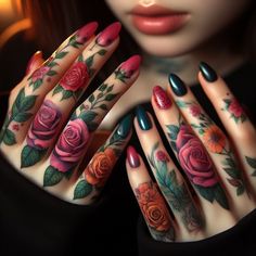 a woman's hands with tattoos and flowers on them, holding her hand up to the camera