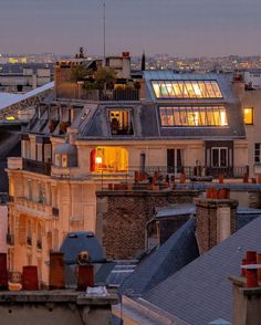 the roofs of buildings are lit up at night