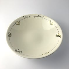 a white bowl with writing on the side