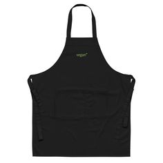 a black apron with green lettering on the front and back, that says triggery