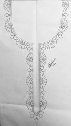 a drawing of a cross with flowers and leaves on the side, in black and white