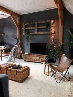 an instagram photo of a living room with dark blue walls and white carpeting