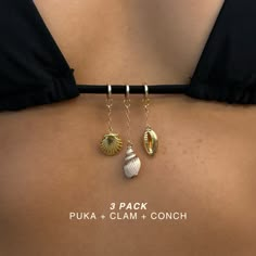 Elevate your beach day experience with the Nautica Bikini Charms. These unique charms will level up your style and sun tan. Say goodbye to boring beach days & hello to a whole new level of fun and fashion. The Nautica Bikini Charms are perfect for the beach babes & sun worshippers. Product Details: FINAL SALE 14k Gold-Filled Swimsuit Clasp 7 Available Charms: 14k Gold Plated CZ Moon 14k Gold-Filled CZ Sun 14k Gold Plated CZ Star Tag 14k Gold-Filled Puka Shell 14k Gold Plated Clam Shell 14k Gold Shells Accessories, Sea Shells Jewelry, Jewelry Mood Board, Swimsuit Jewelry, Surf Jewelry, Vacation Jewelry, Seashell Jewelry, Puka Shell, Clam Shell