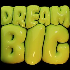 the words dream big are made out of yellow plasticine letters on a black background