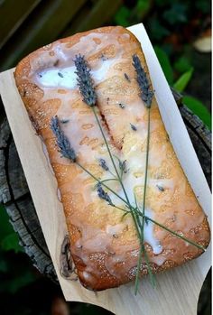 a piece of bread sitting on top of a wooden cutting board