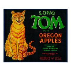 an orange and black cat sitting on top of a label that says long tom brand oregon apples