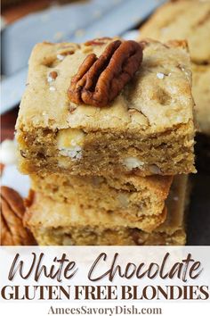 several pieces of cake sitting on top of each other with pecans in the middle