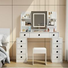 a bedroom with a bed, dresser and mirror