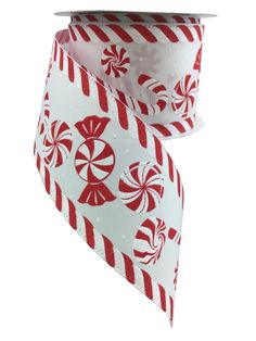 a white and red ribbon with candy canes printed on the side, in front of a white background