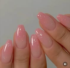 a woman's hand with pink nail polish on her nails and the tip of her fingers