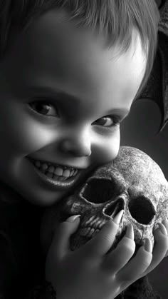 a young boy is holding a skull and smiling