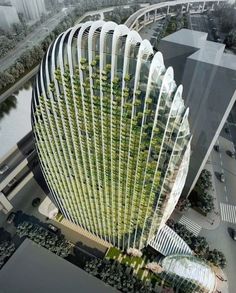 an aerial view of a building with trees growing on the top and bottom part of it