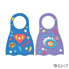 two bibs with different designs on them, one is blue and the other is purple