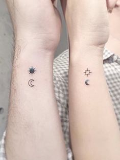 two people with matching tattoos on their arms