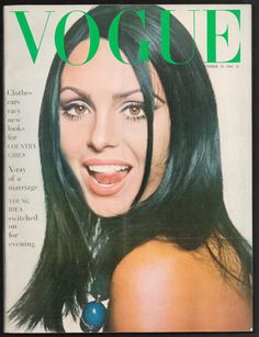 a woman with long black hair on the cover of a magazine, showing an image of herself smiling