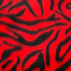 a red and black zebra print fabric with some sort of animal pattern on it's side