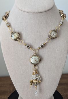 This  necklace has 5 beautiful vintage watches, at least one of which is stamped 10K gold plated bezel. Dangling form the center watch are gold filled beads as well as silver tone beads and some clear crystals for sparkle. Links that I made to separate the other watches are also comprised of gold tone, gold filled and silver beads. The clasp is a large lobster claw clasp. This one is stunning! These necklaces make a statement and are perfect for anyone who loves vintage or steampunk style. Wear one on its own for a simple and elegant look, or pair with one of my bracelets and earrings to create a bold and eye catching outfit. Add a touch of time-worn charm to your jewelry collection! **I welcome custom orders! If you have something special from a loved one that I can incorporate into a des Clock Earrings, Time Costume, 2024 Jewelry, Sundance Style, Vintage Jewelry Crafts, Necklace Ideas, Old Watches, Steampunk Style, Clear Crystals