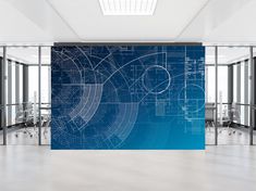 an office with blueprinted walls and glass partitions