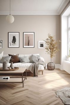 a living room filled with furniture and pictures on the wall