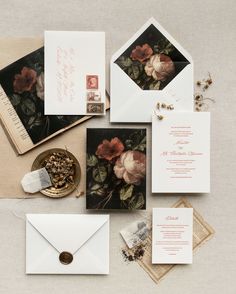 an assortment of wedding stationery items including envelopes, cards, and other decorations