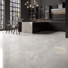 an empty kitchen with large windows and white tile flooring, along with black cabinets