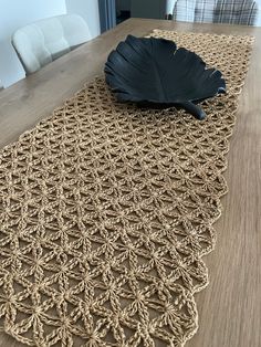 a table with a large black leaf on it