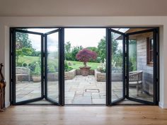 an open patio door leading to a garden