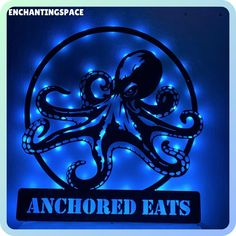 an illuminated sign that reads anchored eats with an octopus on it's head and the words, enchanting space