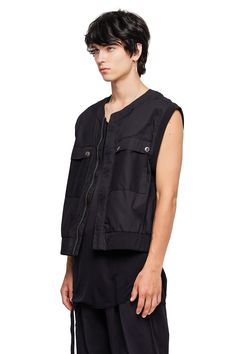 The Sleeveless Jacket is a sporty layering piece crafted from baby canvas suede with nickel hardware, a lay flat band collar, and a tailored boxy fit. — Center zipper closure— Button pockets on torso — Nickel zipper and snap details on body— 100% cotton baby canvas suedeSIZE + FIT— Slightly cropped fitted jacket — Fits true to size; if between sizes, size up— Model is 6’0 and wearing a size LCARE— Dry clean recommended Sleeveless Jacket Outfit, Baby Canvas, Fitted Jacket, Jacket Fits, Nickel Hardware, Design Competitions, Sleeveless Jacket, Band Collar, Workout Jacket