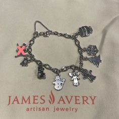 a bracelet with charms on it that says james avery artisan jewelry