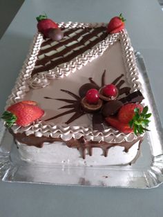 a cake with chocolate and strawberries on top