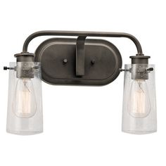 two light bathroom fixture with clear glass shades on the bottom and an old - fashioned metal frame