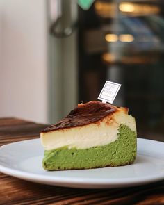 a piece of green and white cake on a plate