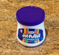 a jar of jel - ruffed marshmallow creme sitting on a counter