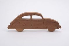 a wooden toy car on a white background