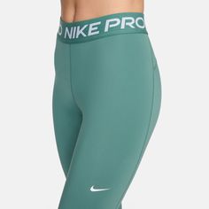 The Nike Pro 365 Women's Tights are perfect for your workout collection. They're snug to your body, ensuring they won't interfere with your best workout. Plus, the Nike branding around the waist will let everyone in the gym know you have an eye for quality. Features: Mid-rise. Tight, body-hugging fit. Nike Dri-FIT technology helps you stay dry, comfortable and focused. A wide, smooth mid-rise waistband feels supportive around your core. Ventilated mesh panels along the back of the lower legs cre Sports Leggings With Contoured Waistband And Medium Support, Green Sportswear Tights For Training, Green Athleisure Tights For Training, Nike Moisture-wicking High-stretch Bottoms, Nike High Stretch Moisture-wicking Bottoms, Nike Sporty Tight Activewear, Green Compression Tights For Running, Nike Athleisure Tights For Workout, Nike Moisture-wicking Yoga Pants For Sports