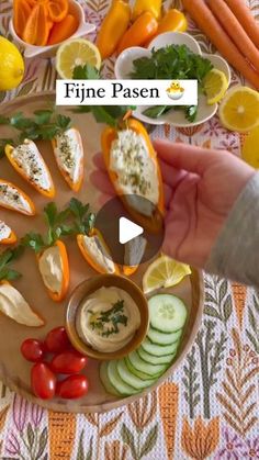 a person holding a plate with food on it and the words fine paen in front of them