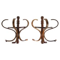 a pair of metal and wood candle holders