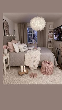 the bedroom is decorated in neutral tones and pink accents, with white accessories on the bed