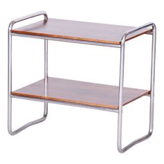 a metal and wood table with two shelves