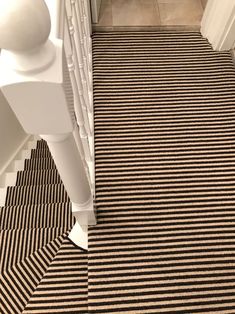 a hallway with black and white stripes on the floor