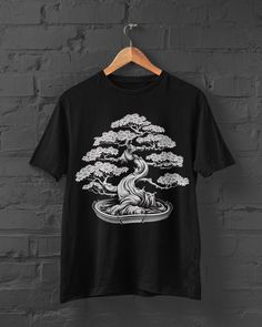 Bring the serene beauty of nature to your wardrobe with our Bonsai Print T-Shirt - a seamless blend of Harajuku style, Japanese Streetwear, and the elegance of a bonsai tree. This Anime Tee features a captivating design inspired by Japanese flora, making it a must-have for those who appreciate the graceful fusion of nature and culture. Whether you're strolling through Harajuku or expressing your love for Anime, this Japanese Tree Tshirt becomes a trendy and unique addition to your wardrobe. Elev Streetwear Japanese, Tree Tshirt, Japanese Tree, Japanese Shirt, Harajuku Style, Anime Tees, Shirt Y2k, Style Japanese, Y2k Clothing