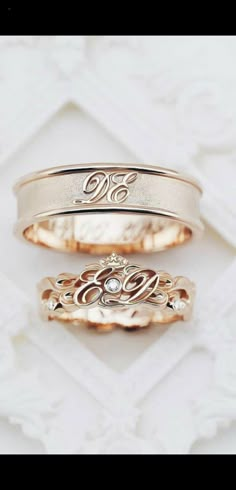 two wedding bands with initials on them