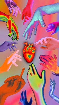 many different colored hands reaching towards a heart