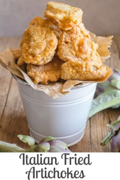 fried artichokes in a bucket with the title overlay reads italian fried artichokes