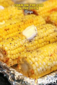 grilled corn on the cob with butter and seasoning sitting on aluminum foil