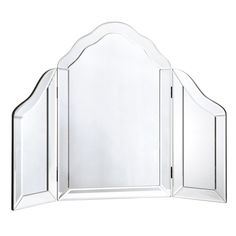 a mirror that is sitting on top of a table with an arch in the middle