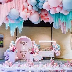 a room filled with lots of balloons and decorations