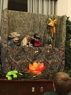 a group of stuffed animals sitting on top of a table