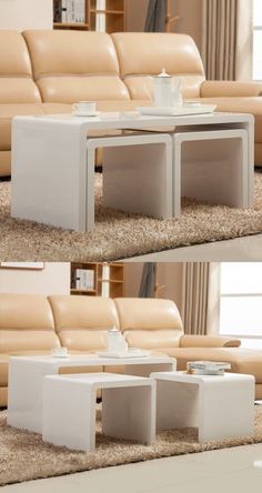 the coffee table is made out of two different pieces of white plastic, and sits in front of a beige leather couch